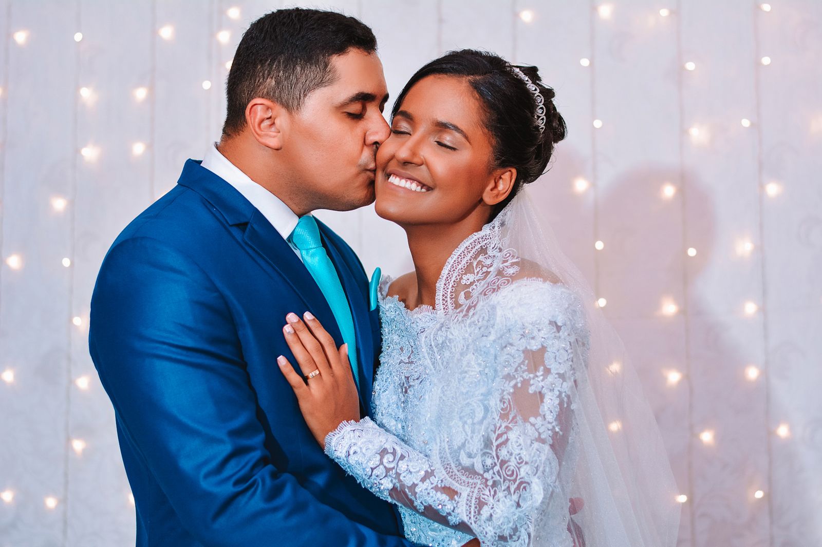 Bride and groom embracing in a romantic wedding portrait